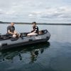 fishing on a lake in British Columbia Canada in an inflatable boat