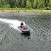 an inflatable boat out for a cruise on a lake in British Columbia Canada