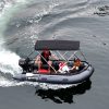 inflatable boat with bimini sunshade exploring the waters of British Columbia Canada