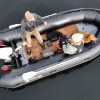 grey inflatable boat with EVA foam on aluminum floor in the lake with man woman and dog