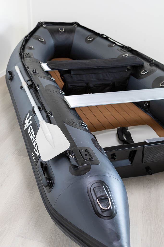 view inside of dark grey inflatable boat with high pressure airmat floor covered in Tan EVA foam.