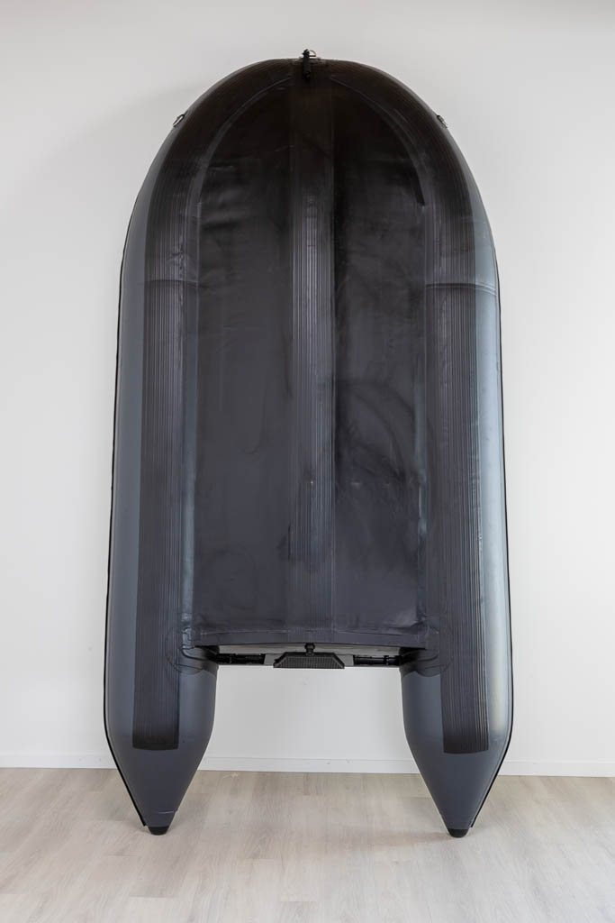 view bottom of dark grey inflatable boat with high pressure airmat floor covered in Tan EVA foam.