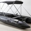 grey inflatable boat with bimini sun shade attached