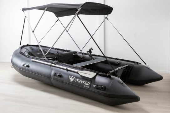 grey inflatable boat with bimini sun shade attached