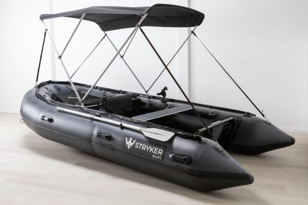 grey inflatable boat with bimini sun shade attached