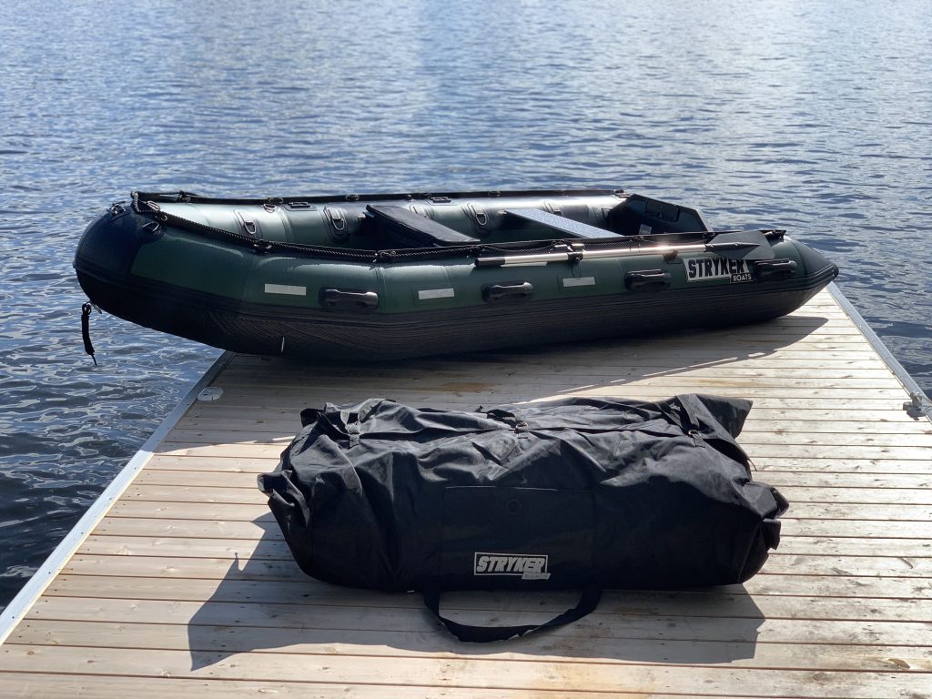 inflatable boat on a dock at the lake