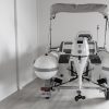 white rigid hull inflatable boat with bimini, integrated console and tohatsu outboard on road runner trailer