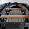 stealth black inflatable jet boat with inflatable floor in showroom