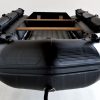 bow view stealth black inflatable jet boat in showroom
