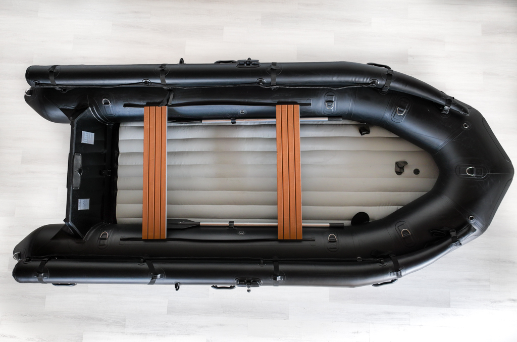 transom of stealth black inflatable jet boat with inflatable floor in showroom